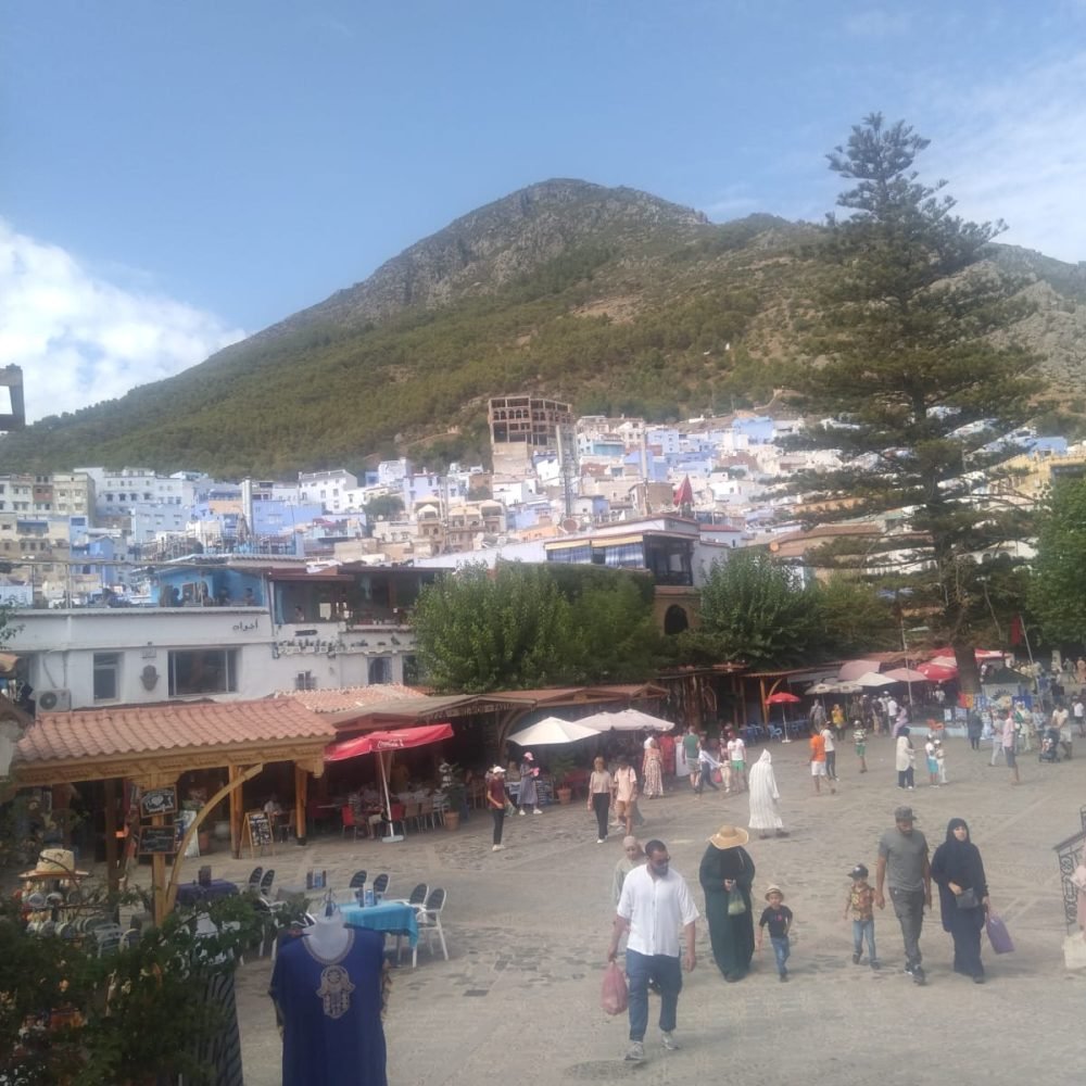 Home 1 36 A group of people at the main square in chefchawen